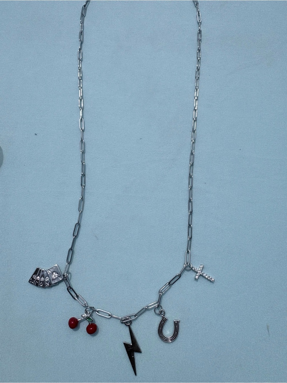 Silver-Tone Charm Necklace with Red Cherry, Lightning, Horseshoe & Cross